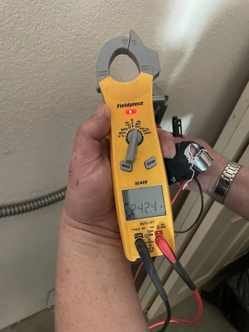 Voltage testing with clamp meter during Whole House Surge Protector in West Norriton